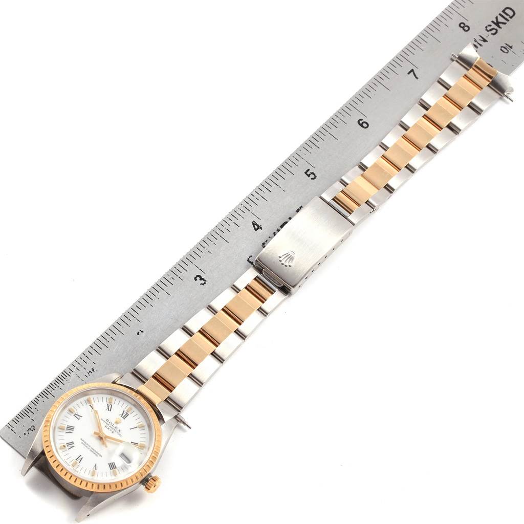 The image shows a Rolex Date 15223 Men's Steel and Gold (two tone) White Dial 15223 Men's Steel and Gold (two tone) White Dial watch laid flat with a two-tone bracelet and a ruler measuring it.