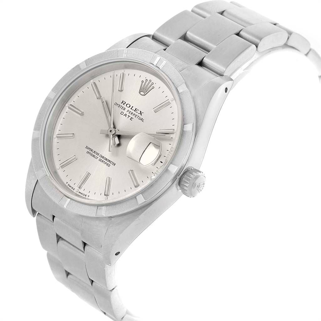 The image shows a side-angle view of the Rolex Oyster Perpetual Date model, highlighting the dial, bezel, bracelet, and crown.