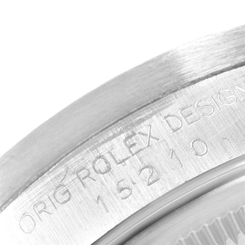 The close-up image shows the "Orig Rolex Design" and model number engraving on the case back of a Rolex Date 15210 Men's Stainless Steel Silver Dial 15210 Men's Stainless Steel Silver Dial watch.
