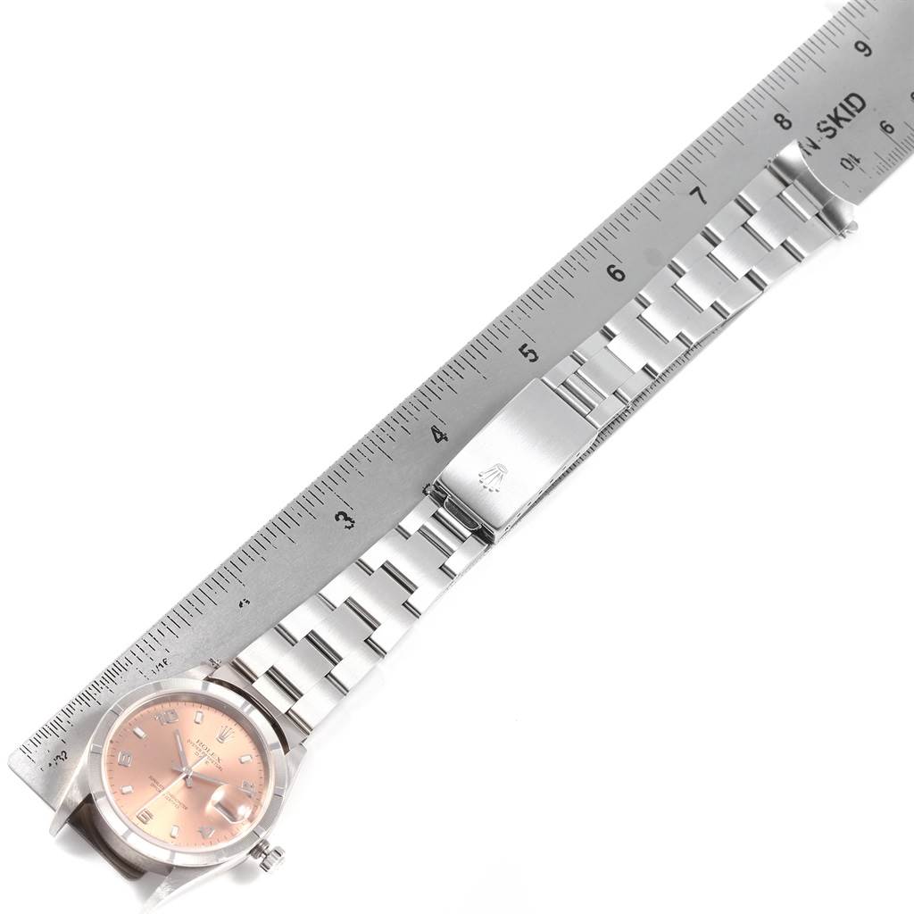 The image shows the face, bezel, and bracelet of a Rolex Date 15210 Men's Stainless Steel Pink Dial 15210 Men's Stainless Steel Pink Dial model watch, measured with a ruler.