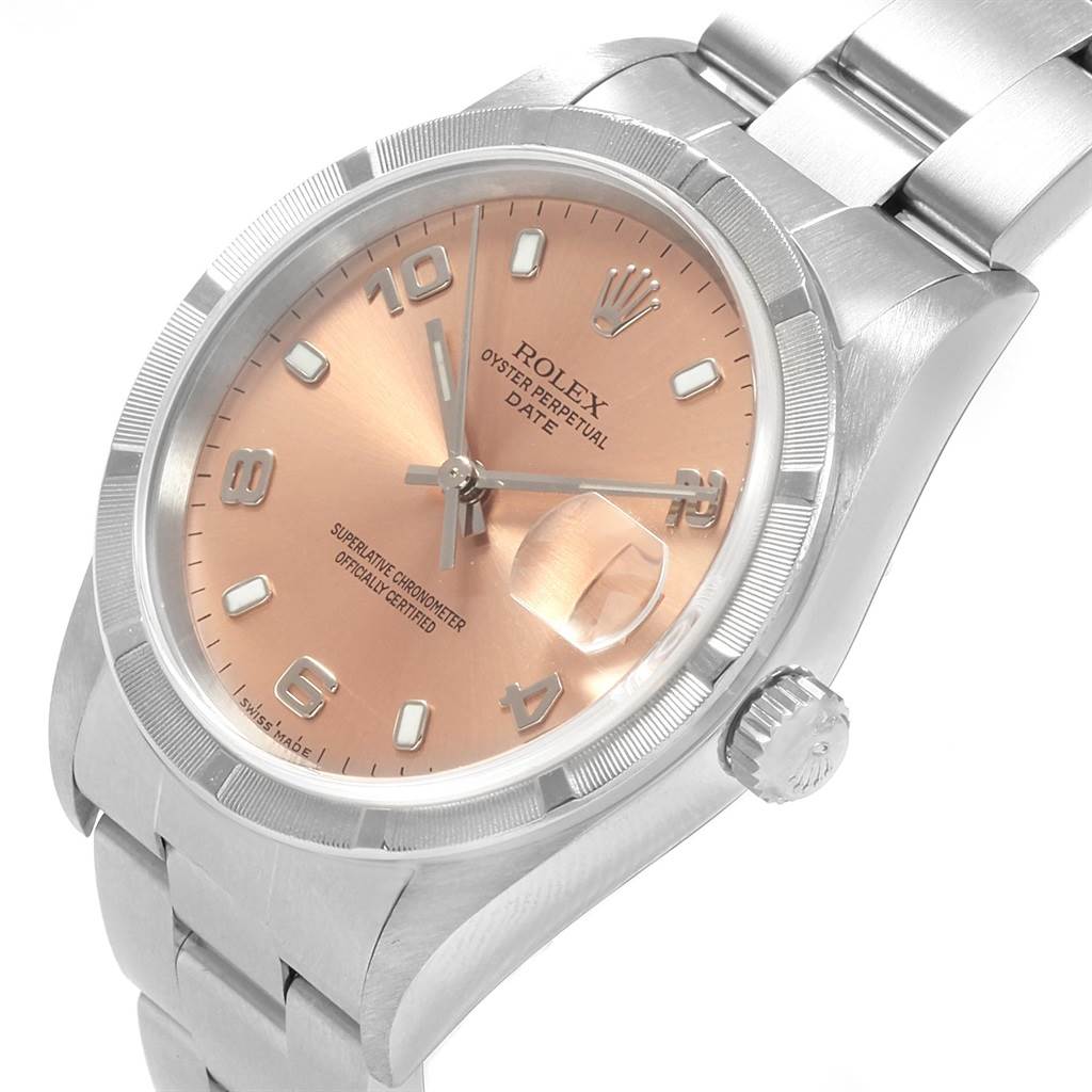This image shows a Rolex Date 15210 Men's Stainless Steel Pink Dial 15210 Men's Stainless Steel Pink Dial watch from an angled close-up, revealing the dial, crown, case, and part of the bracelet.