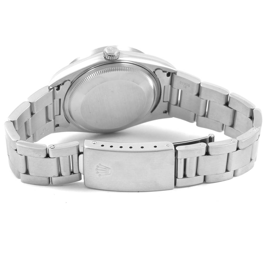 The image shows the back view of a Rolex Date 15210 Men's Stainless Steel Silver Dial 15210 Men's Stainless Steel Silver Dial model watch, highlighting the case back, crown, and metal bracelet with clasp.