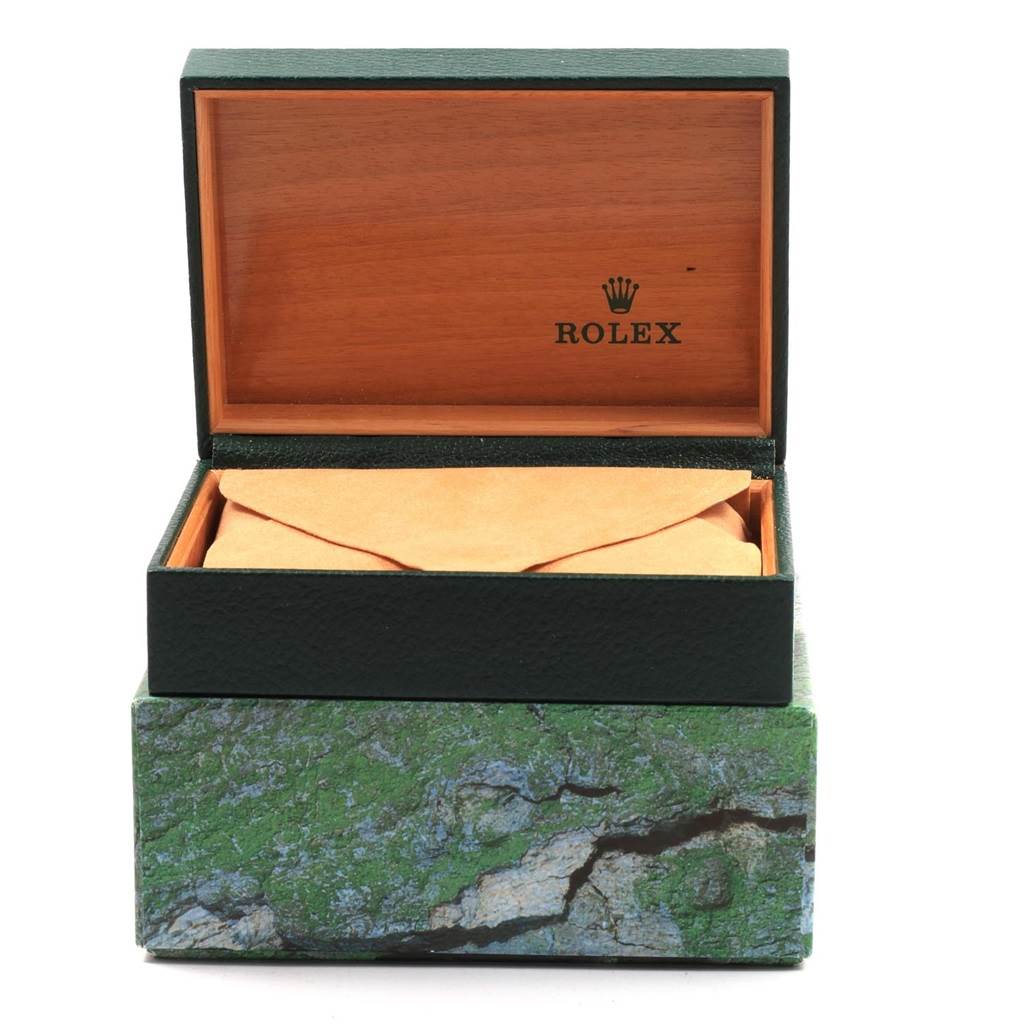 The image shows a Rolex Date 15210 Men's Stainless Steel Silver Dial 15210 Men's Stainless Steel Silver Dial model watch box, partially open, revealing an inner envelope.