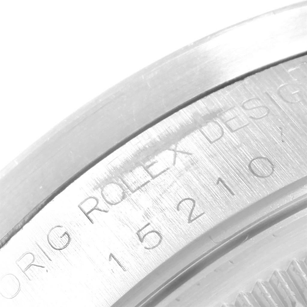 The image shows a close-up of the case back and model number engraving on the Rolex Date 15210 Men's Stainless Steel Silver Dial 15210 Men's Stainless Steel Silver Dial watch.