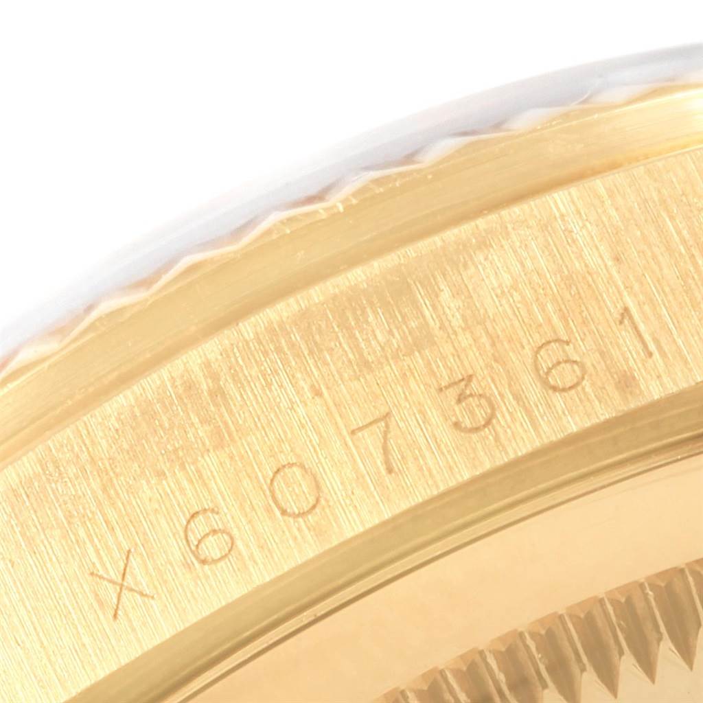 This image shows a close-up of the serial number engraved on the case of a Rolex Date 16238 Men's Yellow Gold Champagne Dial 16238 Men's Yellow Gold Champagne Dial model watch.