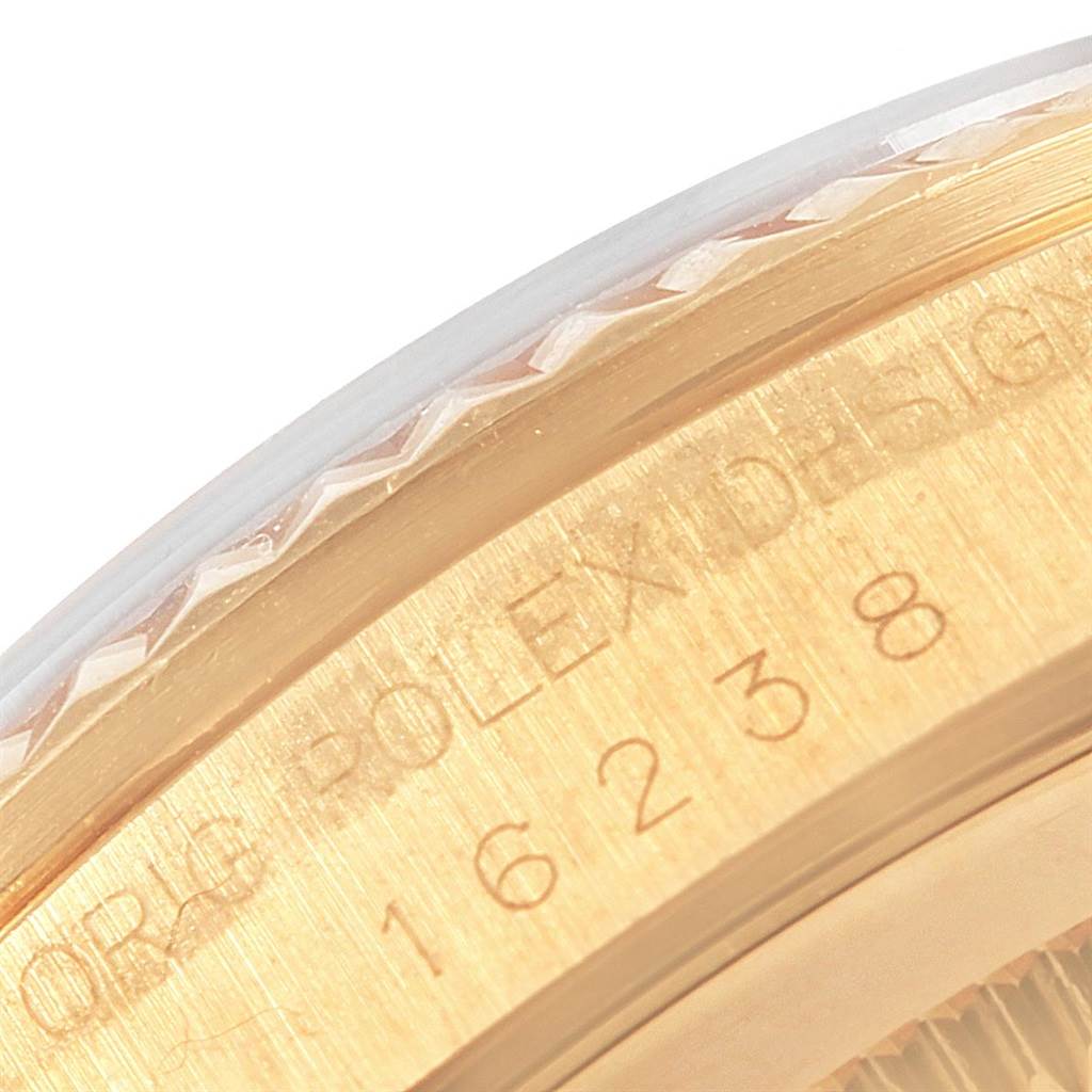This image shows a close-up of the edge of the bezel and case of a Rolex Date 16238 Men's Yellow Gold Champagne Dial 16238 Men's Yellow Gold Champagne Dial model watch.