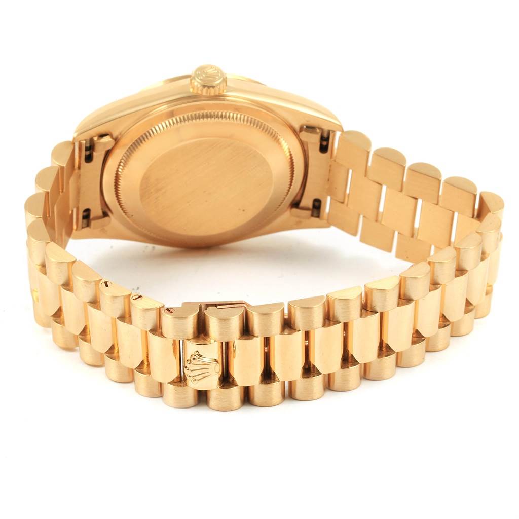 The image shows the back view of a Rolex Date 16238 Men's Yellow Gold Champagne Dial 16238 Men's Yellow Gold Champagne Dial model watch, highlighting its gold case back and bracelet.