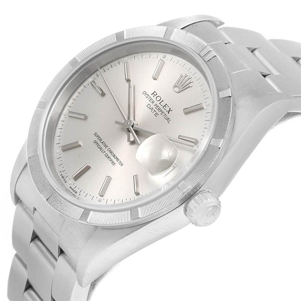This image shows the oblique angle of the Rolex Date 15210 Men's Stainless Steel Silver Dial 15210 Men's Stainless Steel Silver Dial model watch, highlighting the dial, bezel, crown, and part of the bracelet.