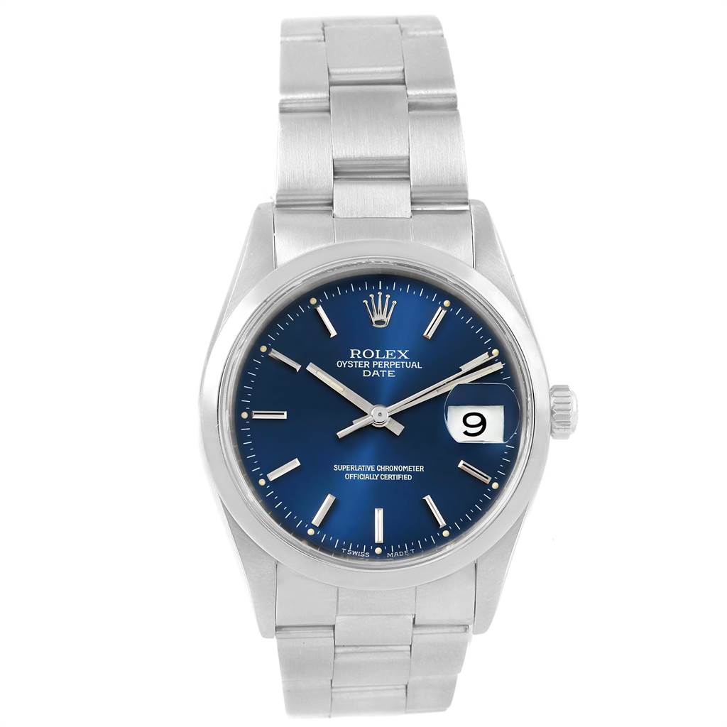 The image shows a front view of a Rolex Oyster Perpetual Date watch, displaying the blue dial, date window, and metal bracelet.