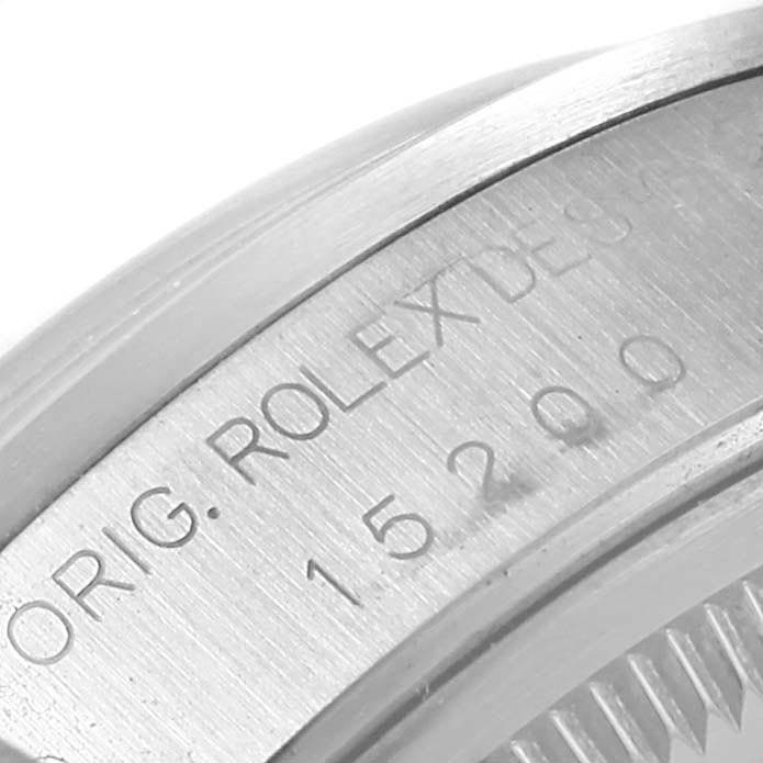 This close-up image shows the engraved model number on the case of a Rolex Date 15200 Men's Stainless Steel Blue Dial 15200 Men's Stainless Steel Blue Dial watch.