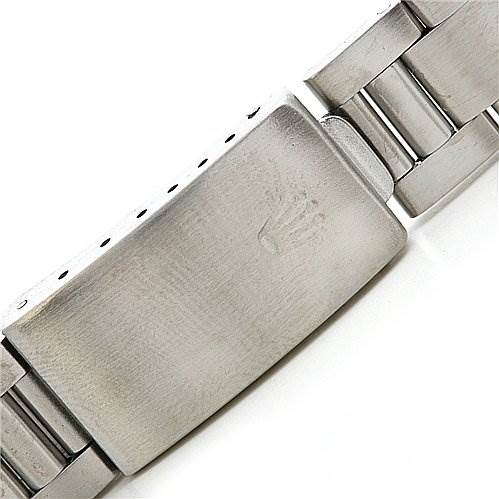The image shows a close-up of the clasp and bracelet of a Rolex Date 15010 Men
s Stainless Steel Champagne Dial 15010 Men
s Stainless Steel Champagne Dial model watch.