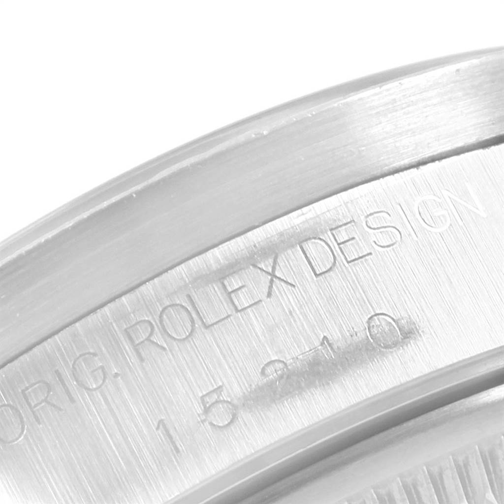 The image shows a close-up of the engraved text on the side of a Rolex Date 15210 Men's Stainless Steel Black Dial 15210 Men's Stainless Steel Black Dial model watch.