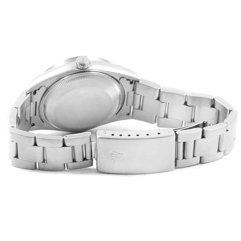 The image shows the back view of a Rolex Date 15210 Men's Stainless Steel Black Dial 15210 Men's Stainless Steel Black Dial model watch, highlighting the case back, crown, and bracelet with clasp.