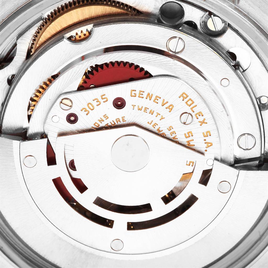 The image shows a close-up view of the internal mechanism of the Rolex Date 15053 Men's Steel and Gold (two tone) Champagne Dial 15053 Men's Steel and Gold (two tone) Champagne Dial model watch. Parts like gears and the rotor are visible.