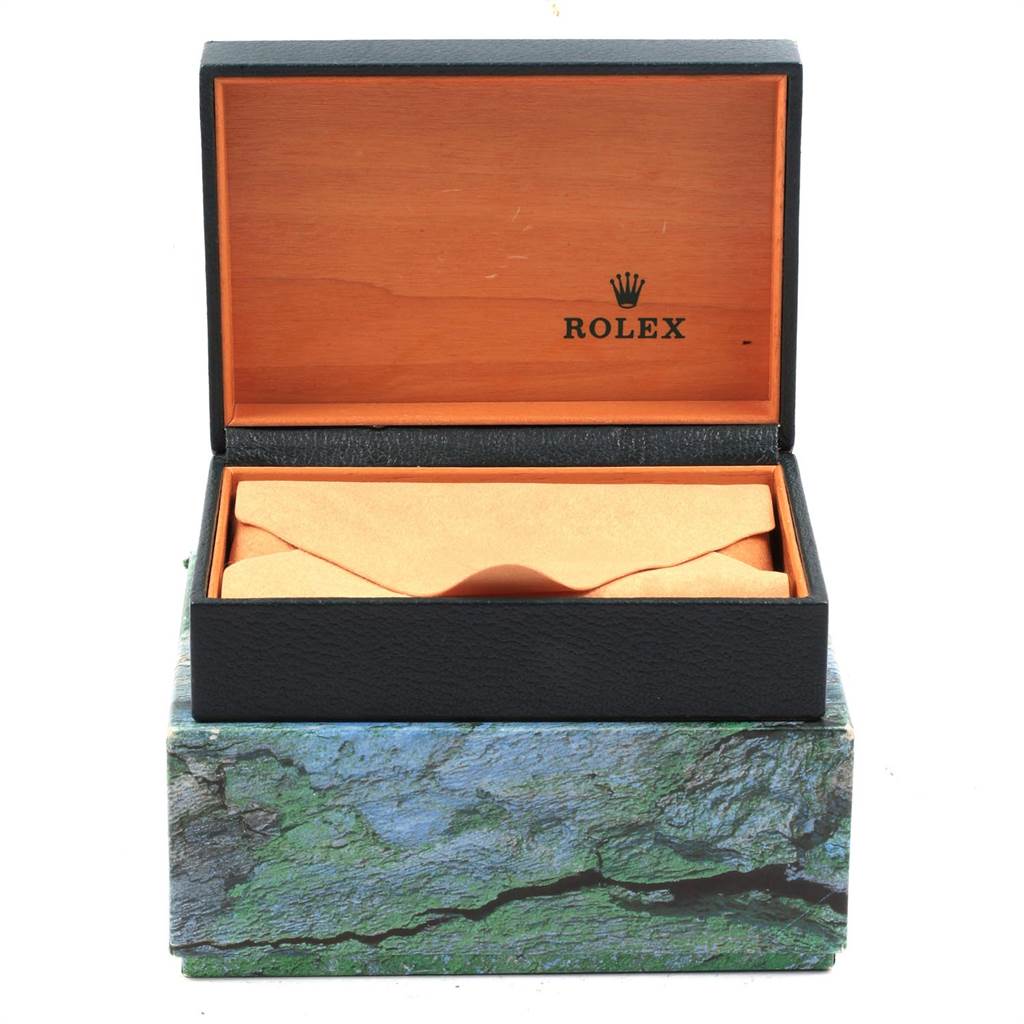 An open Rolex box for the Date model, showing the interior for watch storage.