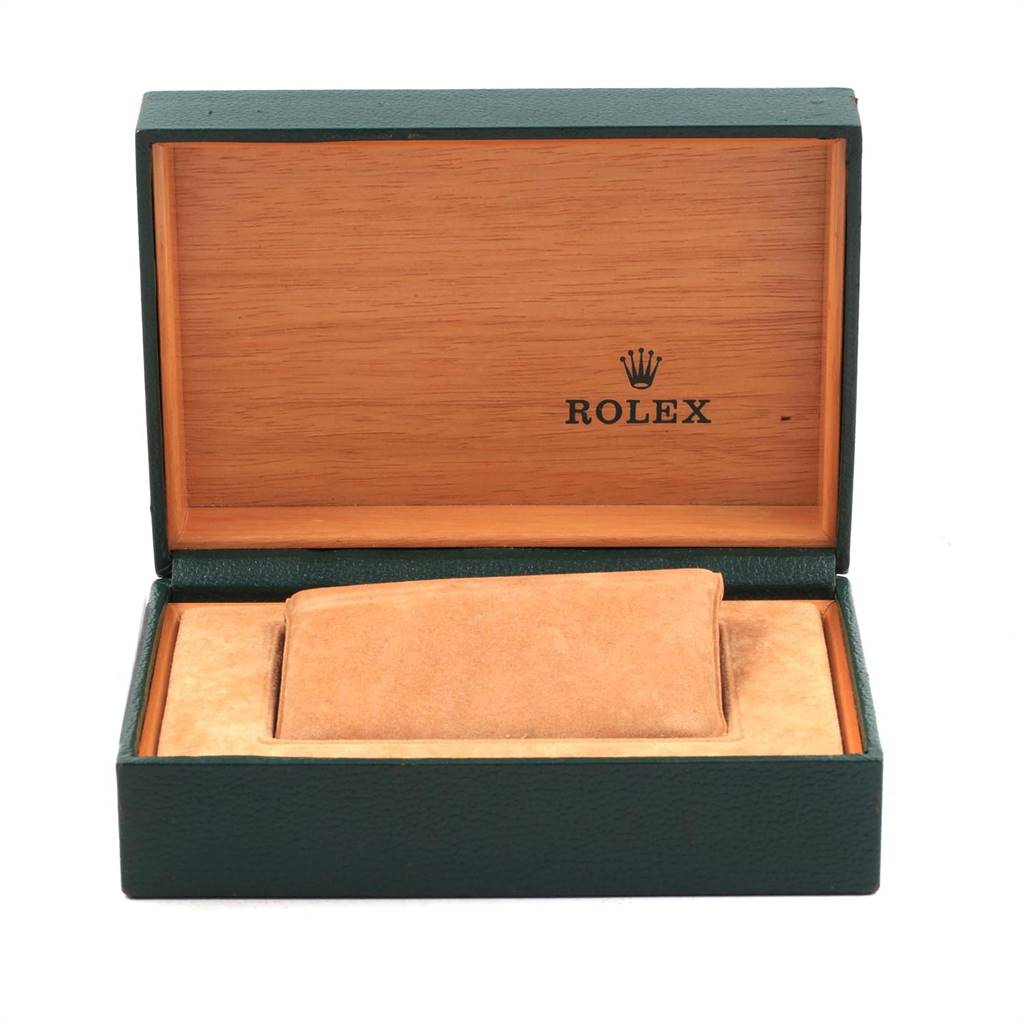 This image shows an open box with a green exterior and wooden interior for a Rolex Date 15200 Men's Stainless Steel White Dial 15200 Men's Stainless Steel White Dial model watch.