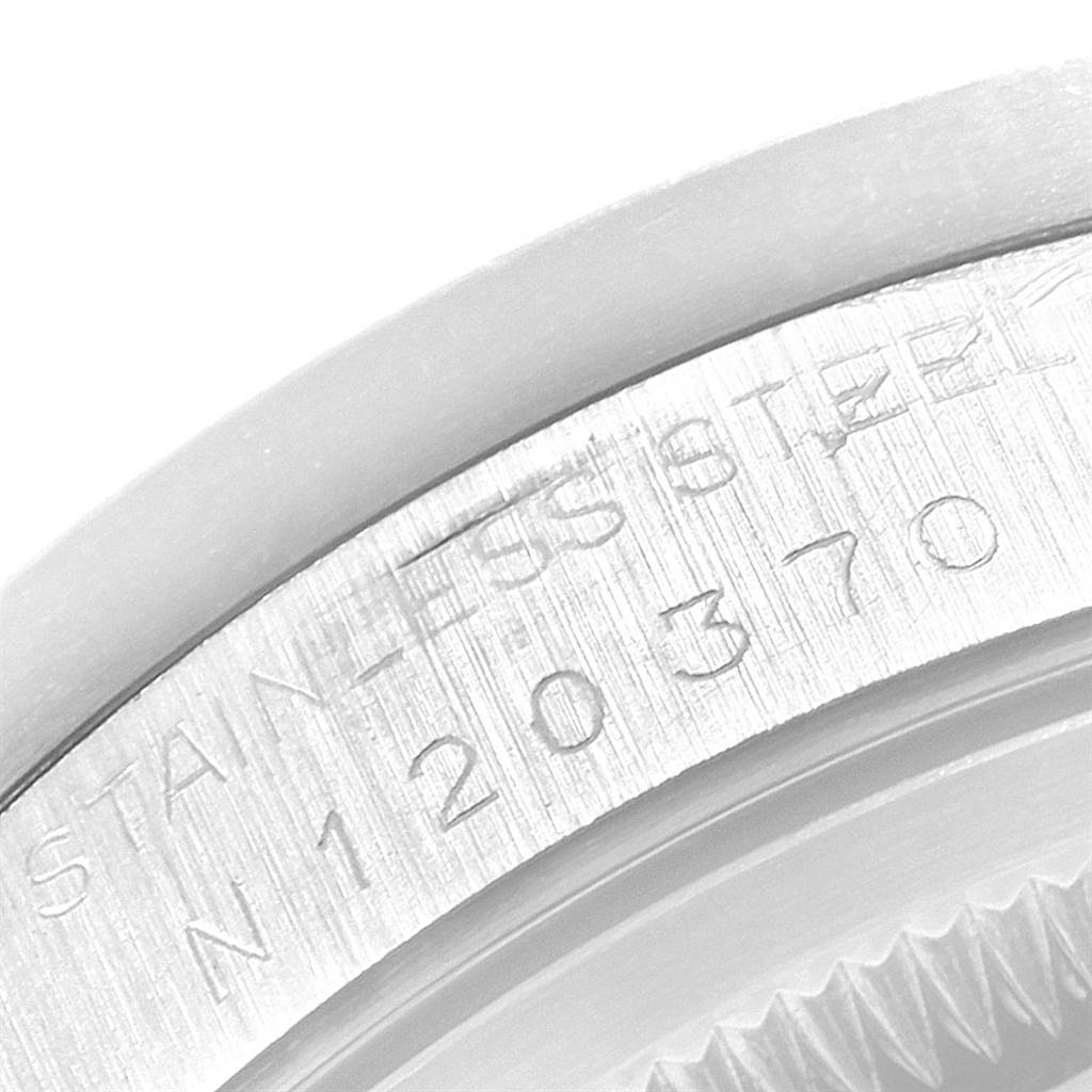 This image shows a close-up view of the serial number engraved on the side of a Rolex Date 15210 Men's Stainless Steel White Dial 15210 Men's Stainless Steel White Dial model watch.