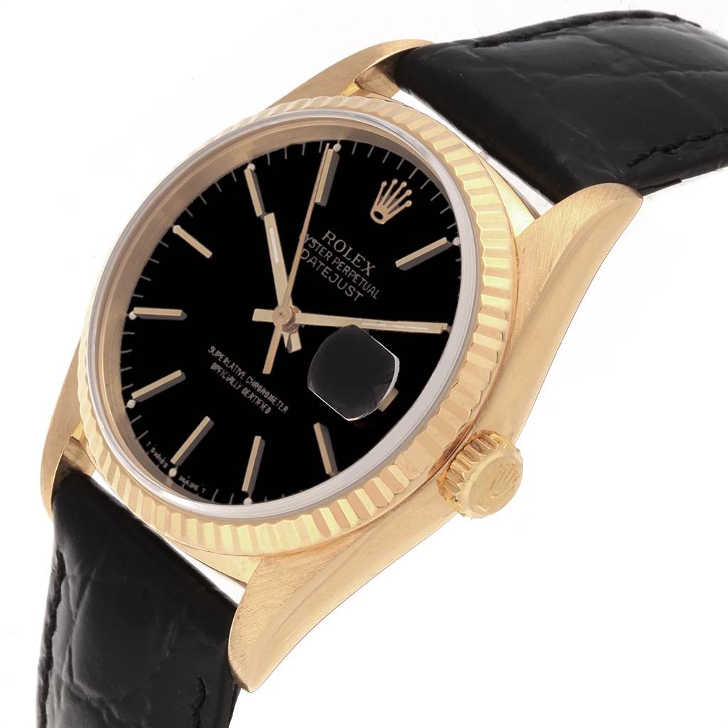 This image shows a Rolex Date 16238 Men's Yellow Gold Champagne Dial 16238 Men's Yellow Gold Champagne Dial model watch angled to display the face, crown, bezel, and part of the black leather strap.