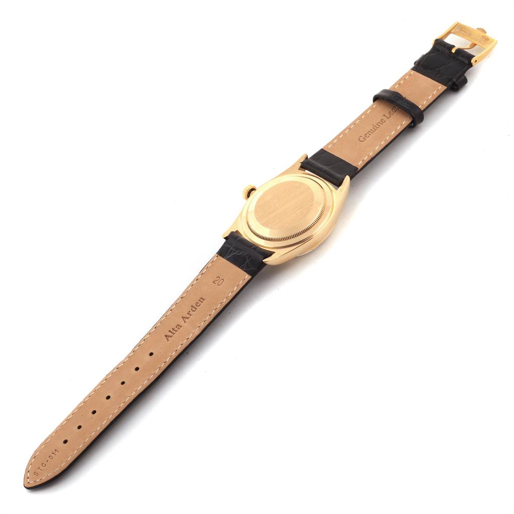 The image shows the back of a Rolex Date 16238 Men's Yellow Gold Champagne Dial 16238 Men's Yellow Gold Champagne Dial watch with leather straps, angled to display the case and strap.