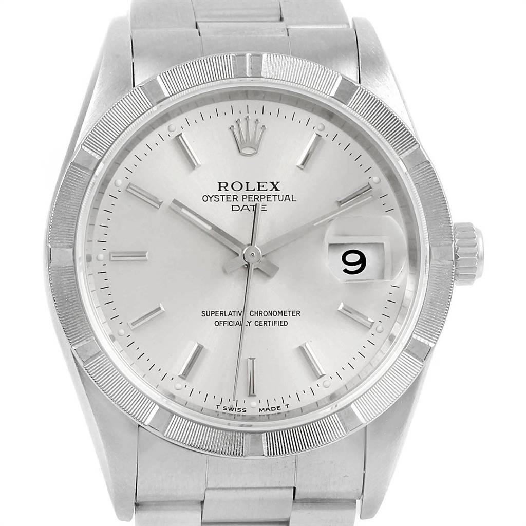 The image shows a front view of a Rolex Oyster Perpetual Date watch, highlighting the dial, hands, bezel, and part of the bracelet.