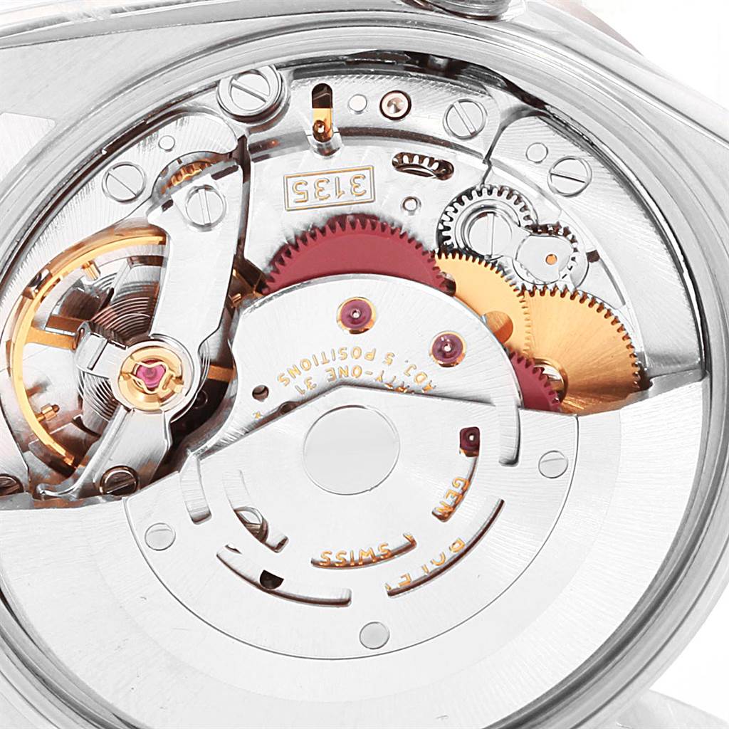 This image shows a close-up view of the movement mechanism inside a Rolex Date 15210 Men's Stainless Steel White Dial 15210 Men's Stainless Steel White Dial model watch, highlighting gears and the balance wheel.