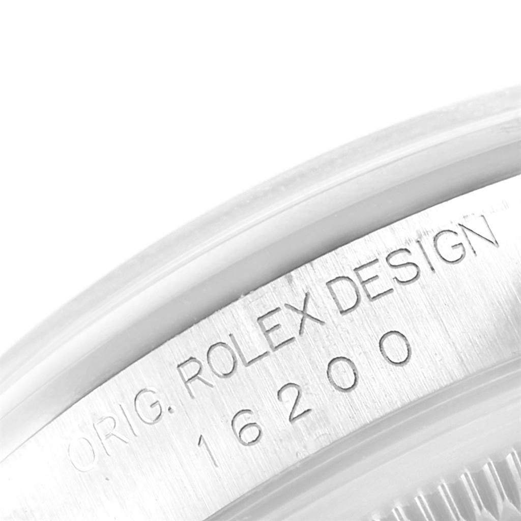 The image shows a close-up of the case side with the engraved serial number of a Rolex Date 16200 Men's Stainless Steel White Dial 16200 Men's Stainless Steel White Dial model 16200.