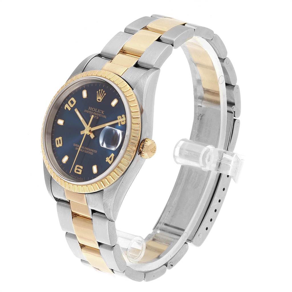 This image shows a Rolex Date 15223 Men's Steel and Gold (two tone) Blue Dial 15223 Men's Steel and Gold (two tone) Blue Dial model watch at an angle, highlighting the face, bezel, crown, and two-tone bracelet.