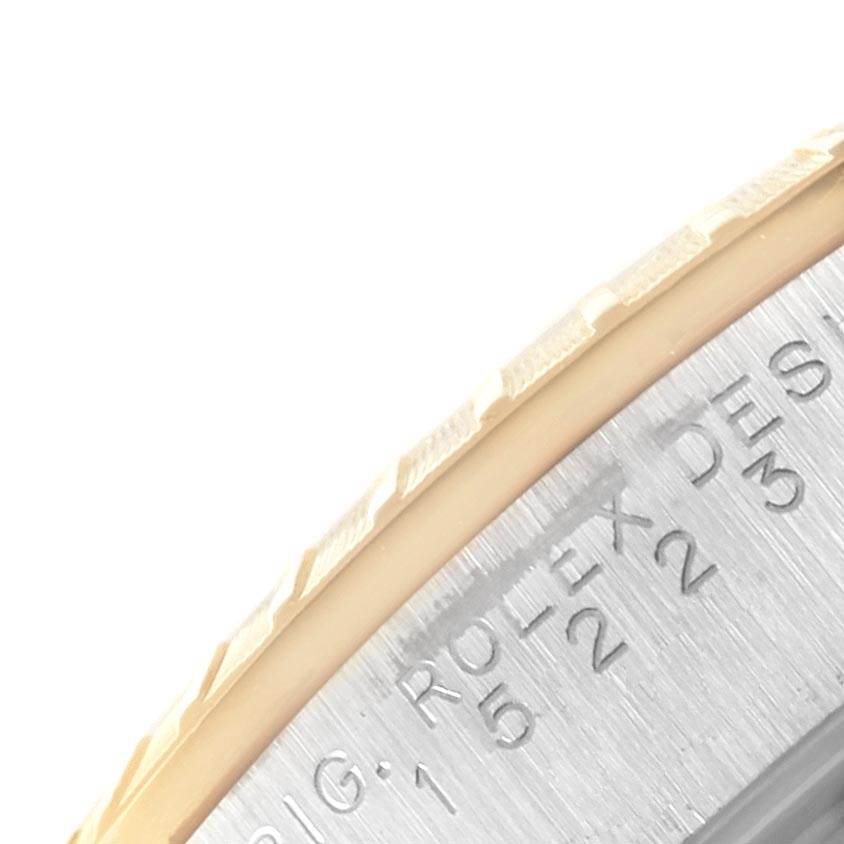 The image shows a close-up of the watch case edge, featuring the fluted bezel of the Rolex Date 15223 Men's Steel and Gold (two tone) Blue Dial 15223 Men's Steel and Gold (two tone) Blue Dial model.