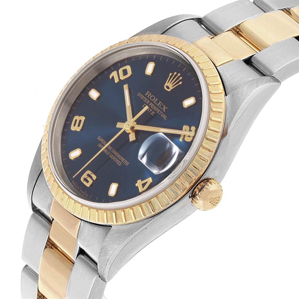 The Rolex Date 15223 Men's Steel and Gold (two tone) Blue Dial 15223 Men's Steel and Gold (two tone) Blue Dial model watch is shown at a front angle, highlighting its blue dial, gold bezel, and two-tone bracelet.