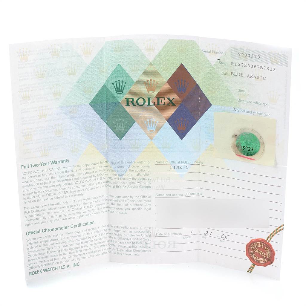 This image shows the warranty certificate and documentation for a Rolex Date 15223 Men's Steel and Gold (two tone) Blue Dial 15223 Men's Steel and Gold (two tone) Blue Dial model watch.