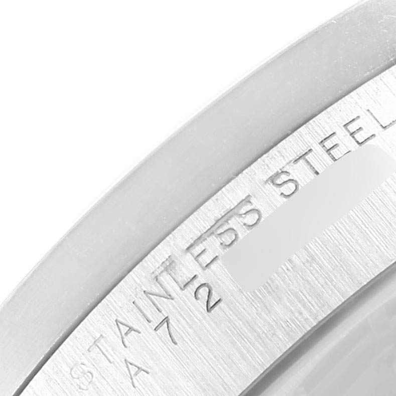 This is a close-up angle showing the stainless steel case back of a Rolex Date 15210 Men's Stainless Steel White Dial 15210 Men's Stainless Steel White Dial model watch.