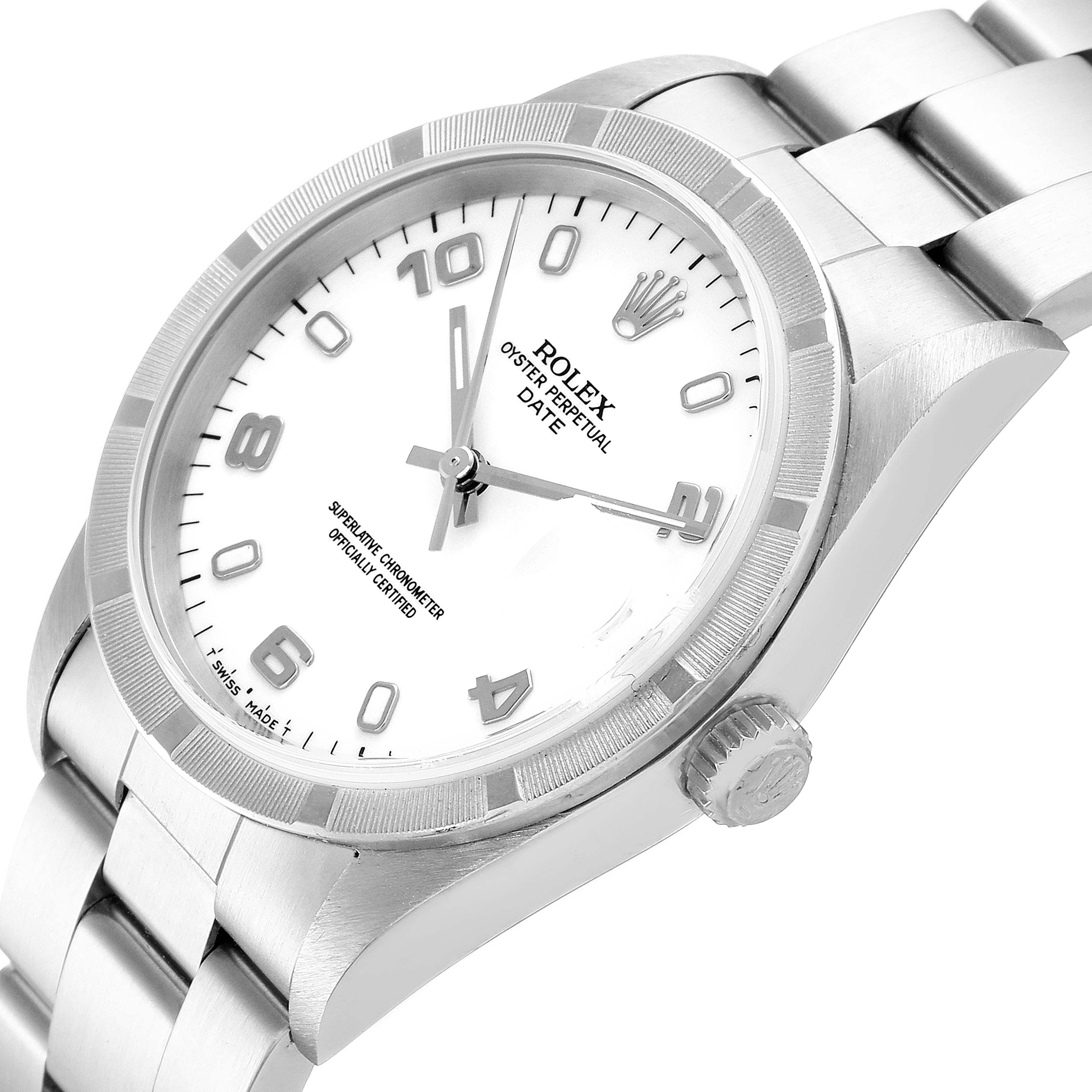 The image shows a Rolex Oyster Perpetual Date watch from an angled top view, highlighting the dial, bezel, crown, and part of the bracelet.