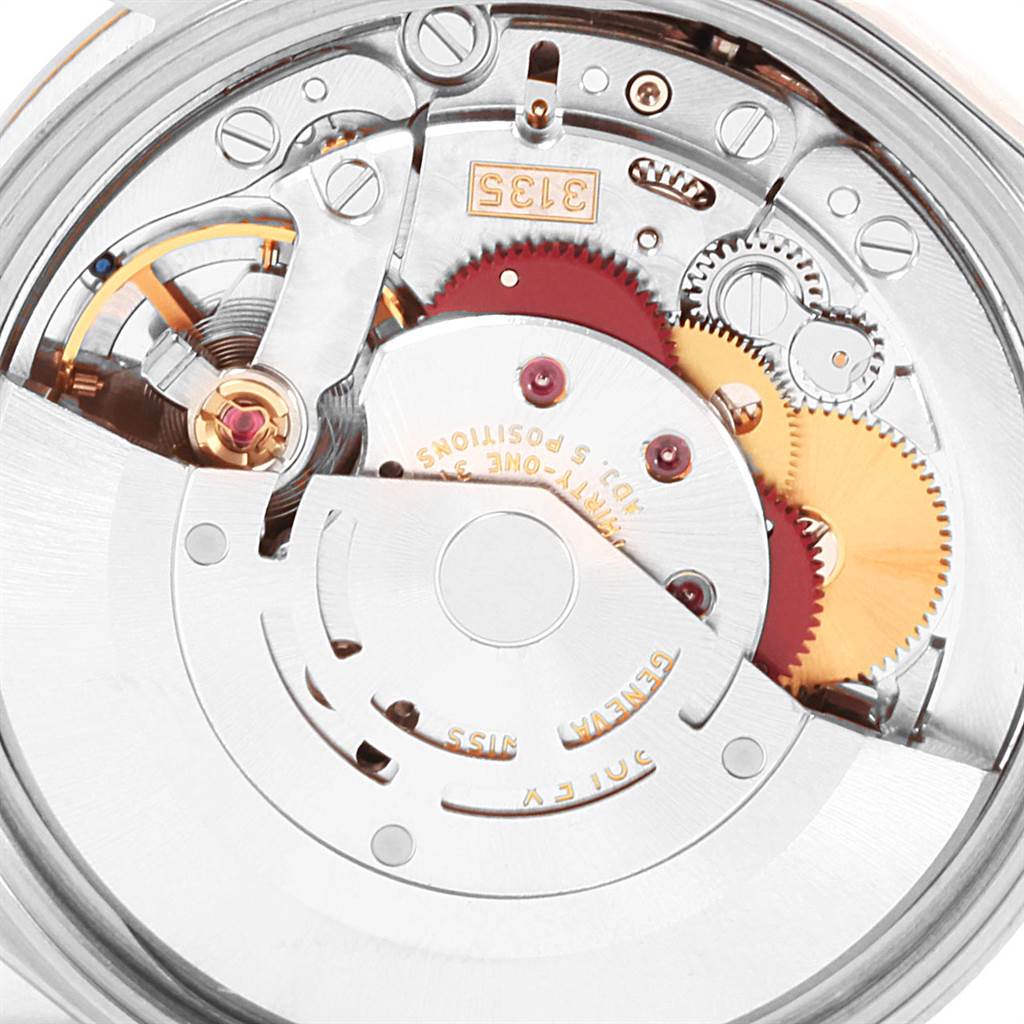 The image shows the intricate internal mechanism and gears of the Rolex Date 15203 Men's Steel and Gold (two tone) Grey Dial 15203 Men's Steel and Gold (two tone) Grey Dial model watch from a close-up angle.