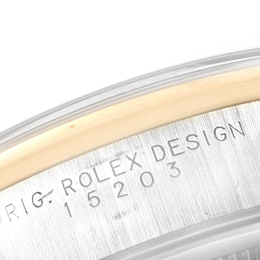 The image shows a close-up angle of the engraved inner case with "ROLEX DESIGN" on a Rolex Date 15203 Men's Steel and Gold (two tone) Grey Dial 15203 Men's Steel and Gold (two tone) Grey Dial watch.