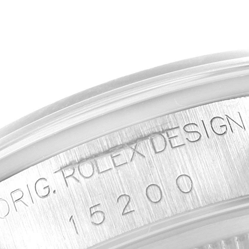 This image shows a close-up of the engraved serial number on the side of the bezel of a Rolex Date 15200 Men's Stainless Steel Silver Dial 15200 Men's Stainless Steel Silver Dial model 15200.