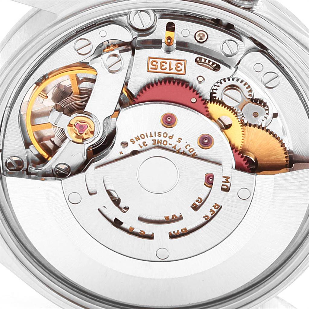 This image shows the internal mechanism of a Rolex Date 15200 Men's Stainless Steel Silver Dial 15200 Men's Stainless Steel Silver Dial model watch with gears, a rotor, and various components visible in close-up.