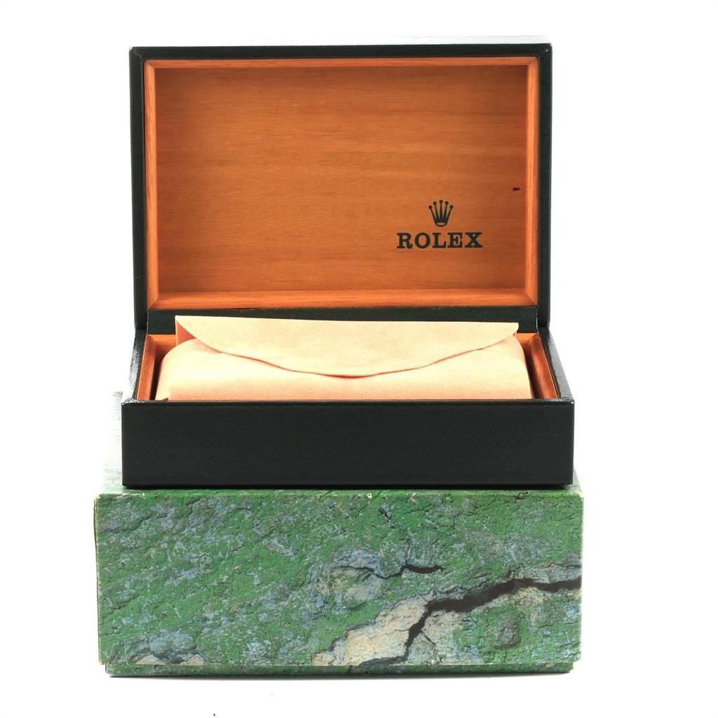 This image shows an open Rolex box with the Rolex logo, holding an envelope, presumably for the Date model watch.