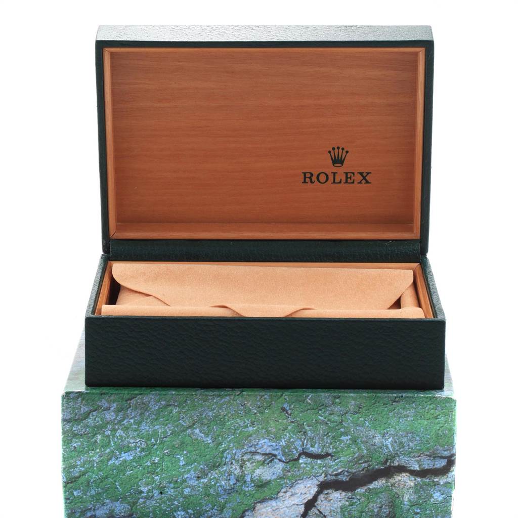 The image shows an open Rolex box for the Date model watch, with the cover showing the Rolex logo.