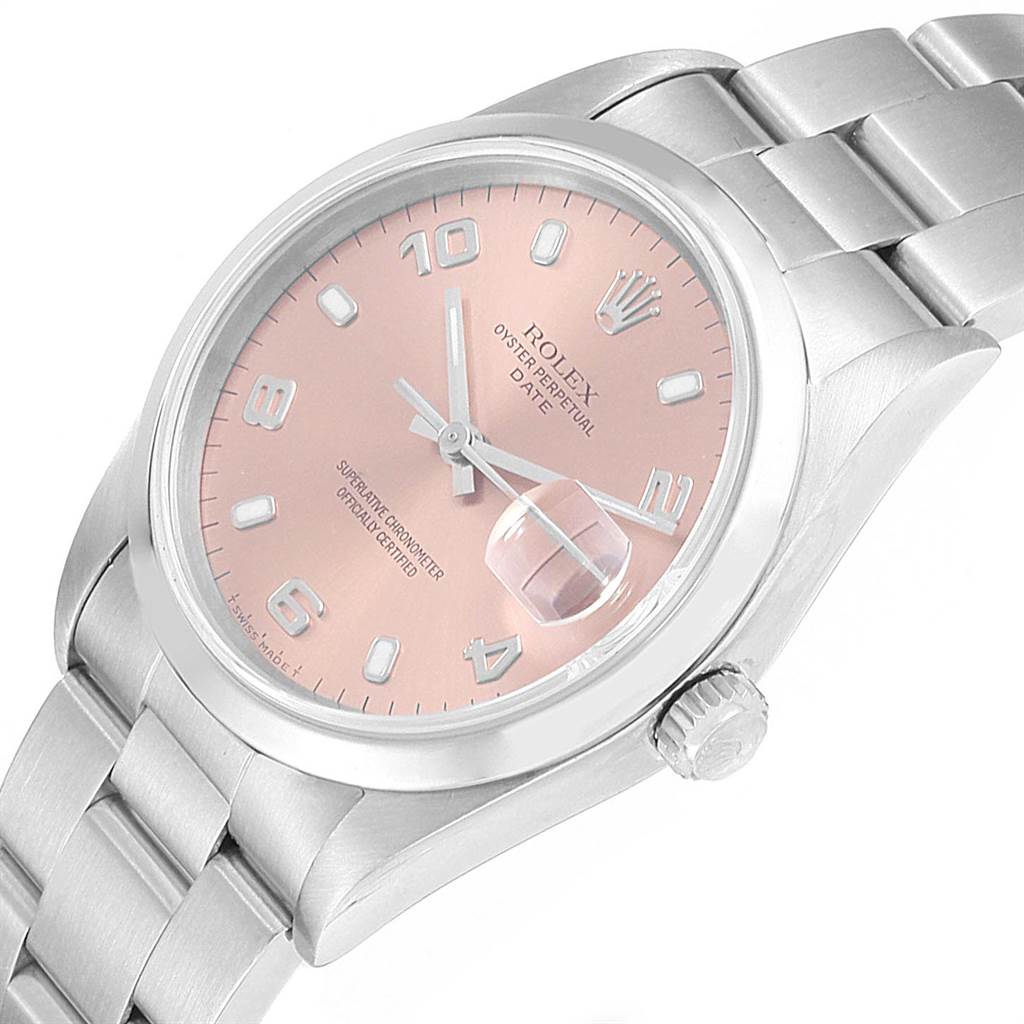 This image shows a Rolex Date 15200 Men's Stainless Steel Pink Dial 15200 Men's Stainless Steel Pink Dial model watch at an angled view, highlighting its pink dial, silver bracelet, and magnified date window.