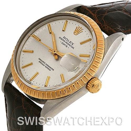 This image shows a Rolex Date 15035 Men's Stainless Steel Silver Dial 15035 Men's Stainless Steel Silver Dial model watch, highlighting its gold fluted bezel, crown, and leather strap from an angled side view.