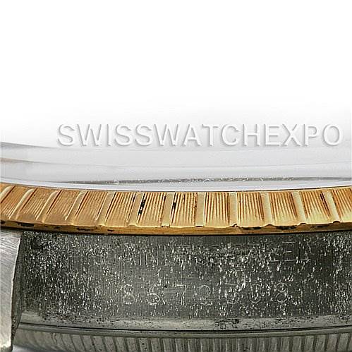 This image shows a close-up angle of the bezel and part of the case of a Rolex Date 15035 Men's Stainless Steel Silver Dial 15035 Men's Stainless Steel Silver Dial watch.