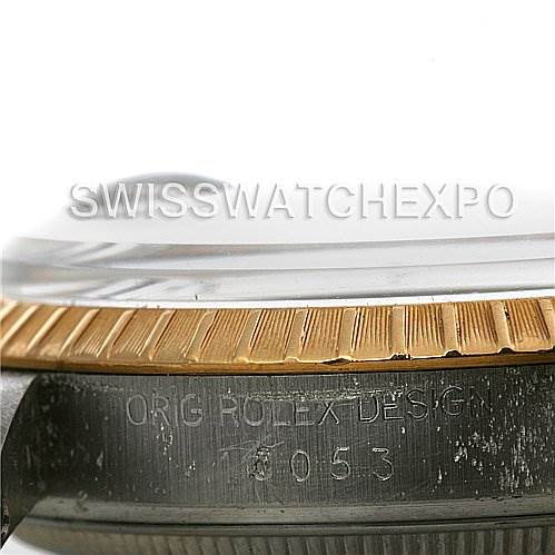 The image shows a close-up side view of a Rolex Date 15035 Men's Stainless Steel Silver Dial 15035 Men's Stainless Steel Silver Dial model watch, focusing on the bezel and case with engraved design details.