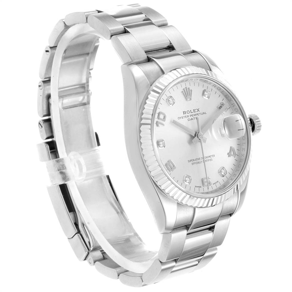 The image shows a side angled view of a Rolex Date 115234 Men's Stainless Steel Silver Dial 115234 Men's Stainless Steel Silver Dial with a close-up of the dial, bezel, and stainless steel bracelet.