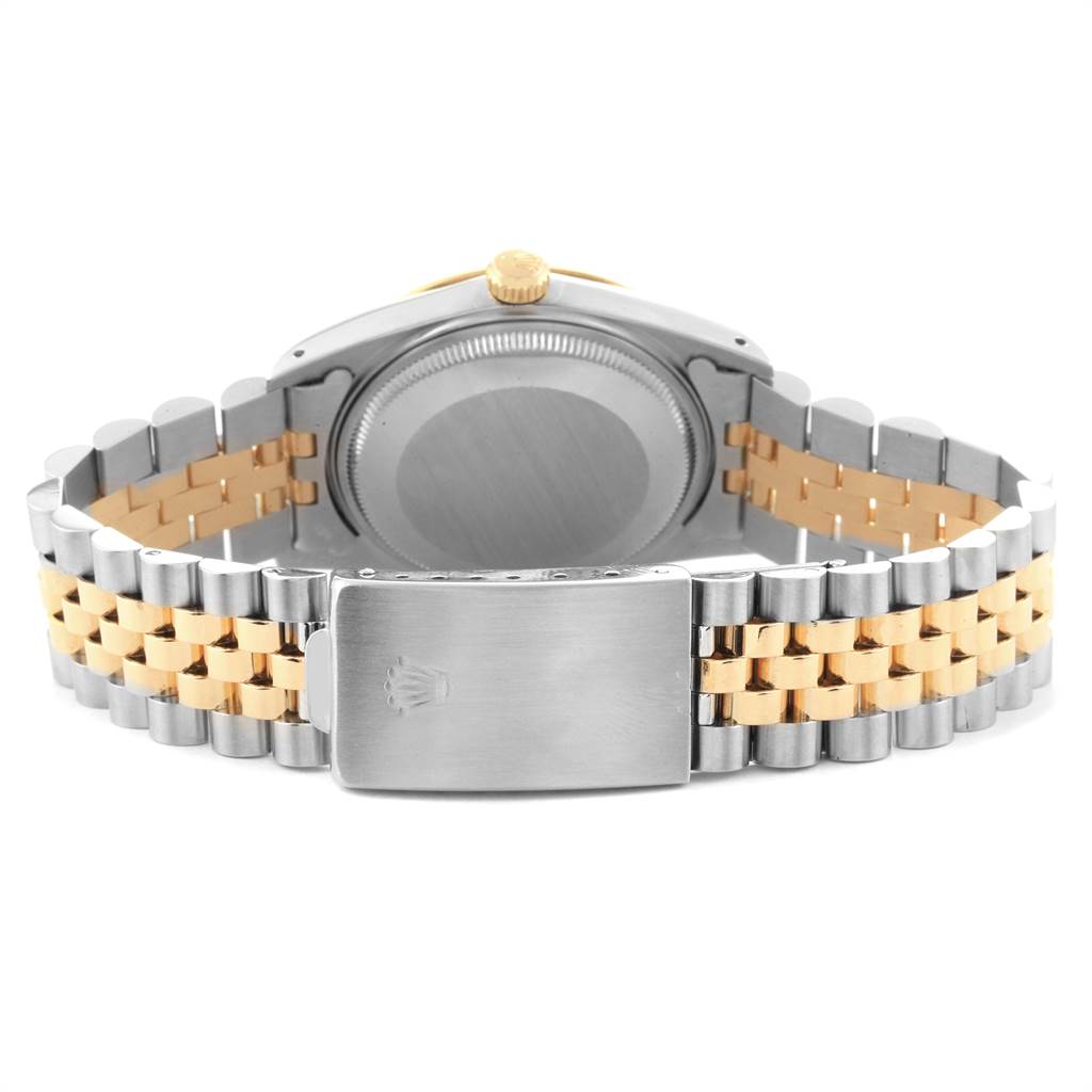 This image shows the backside and clasp of a two-tone Rolex Date 15053 Men's Steel and Gold (two tone) Champagne Dial 15053 Men's Steel and Gold (two tone) Champagne Dial model watch, highlighting the jubilee bracelet and case back.