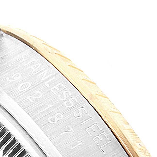 The image shows a close-up of the bezel and the case with engraved inscriptions on a Rolex Date 15053 Men's Steel and Gold (two tone) Champagne Dial 15053 Men's Steel and Gold (two tone) Champagne Dial model watch.