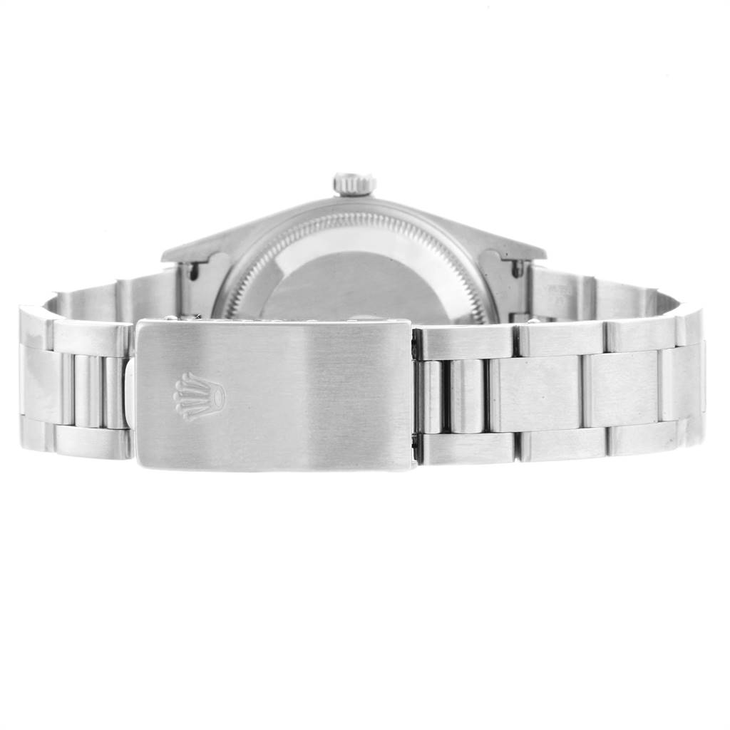 The image shows the back view of a Rolex Date 15210 Men's Stainless Steel Silver Dial 15210 Men's Stainless Steel Silver Dial model watch, highlighting the case back and bracelet with clasp.