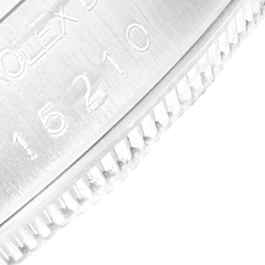 The image shows a close-up of the bezel and the engraved numbers on a Rolex Date 15210 Men's Stainless Steel Blue Dial 15210 Men's Stainless Steel Blue Dial model watch.