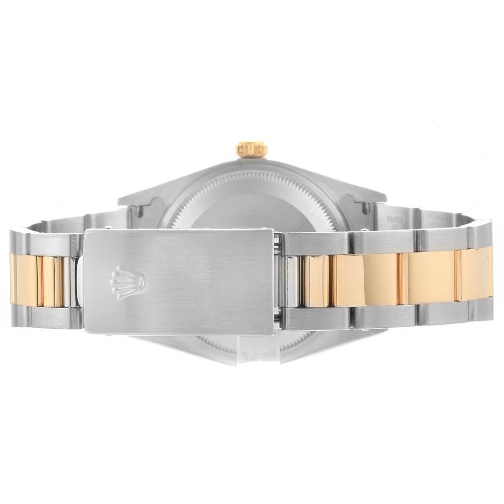 The image shows the back view of a Rolex Date 15223 Men's Steel and Gold (two tone) Champagne Dial 15223 Men's Steel and Gold (two tone) Champagne Dial model watch, focusing on the case and bicolor bracelet with clasp.