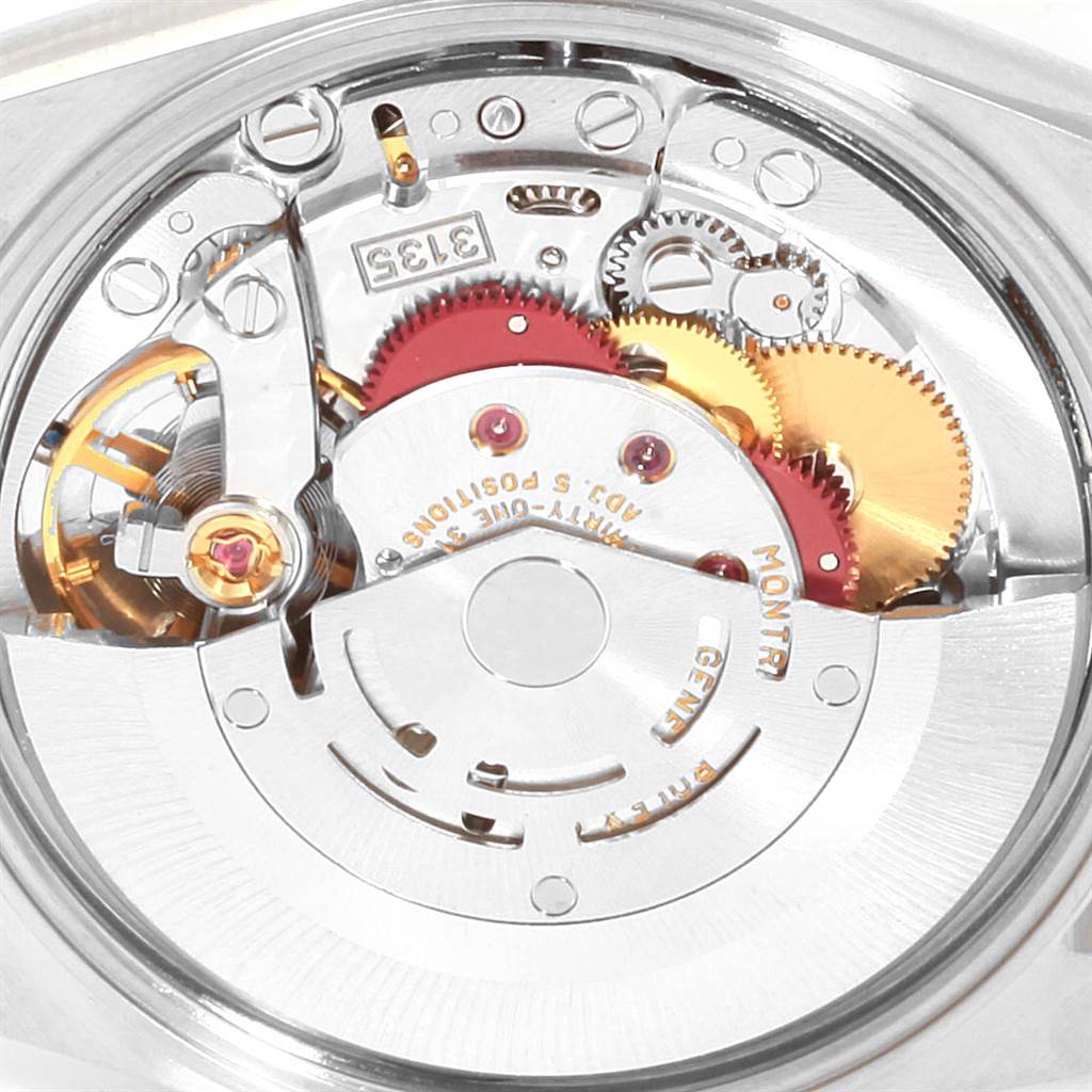 This image shows an up-close view of the intricate internal mechanism of a Rolex Date 15223 Men's Steel and Gold (two tone) Champagne Dial 15223 Men's Steel and Gold (two tone) Champagne Dial model watch.