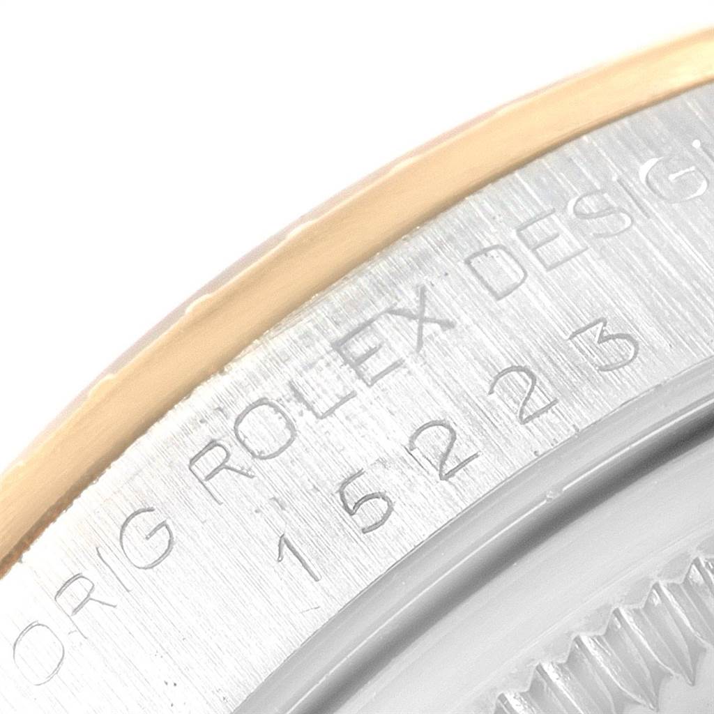 The image shows a close-up view of the bezel and engraved model number of a Rolex Date 15223 Men's Steel and Gold (two tone) Champagne Dial 15223 Men's Steel and Gold (two tone) Champagne Dial watch.